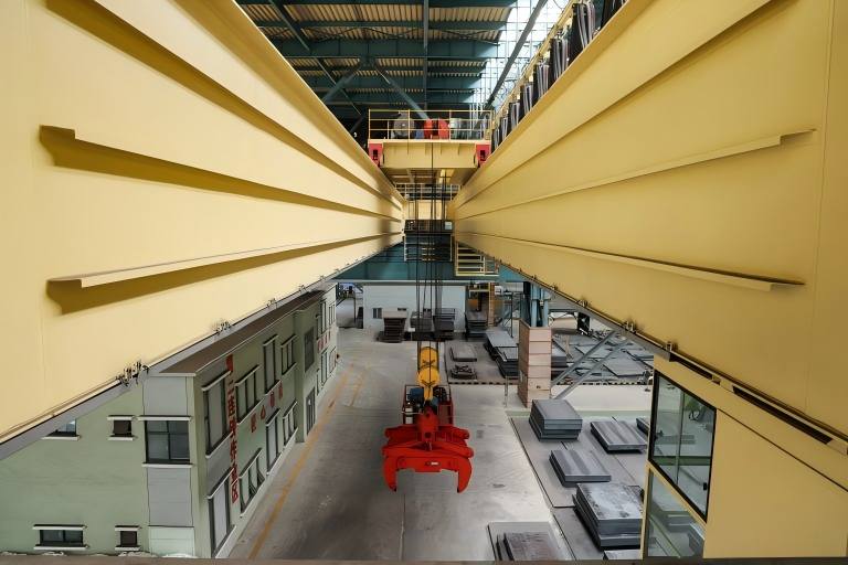 Slab handling overhead crane with tongs manufactured by Henan Mine Crane